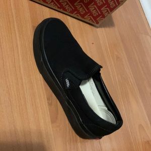 Solid black slip on vans